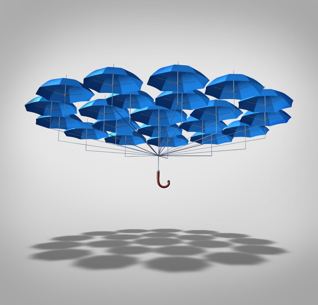 Group of umbrellas clustered together symbolizing protection