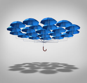 Group of umbrellas clustered together symbolizing protection