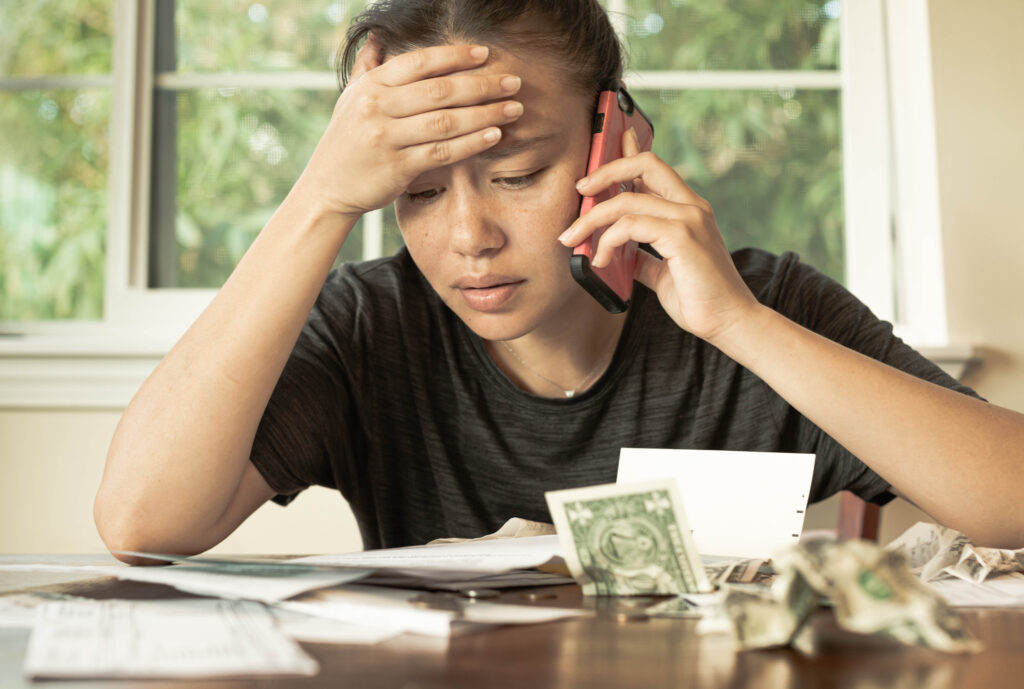 Employee who is stressed over financial challenges making ends meet